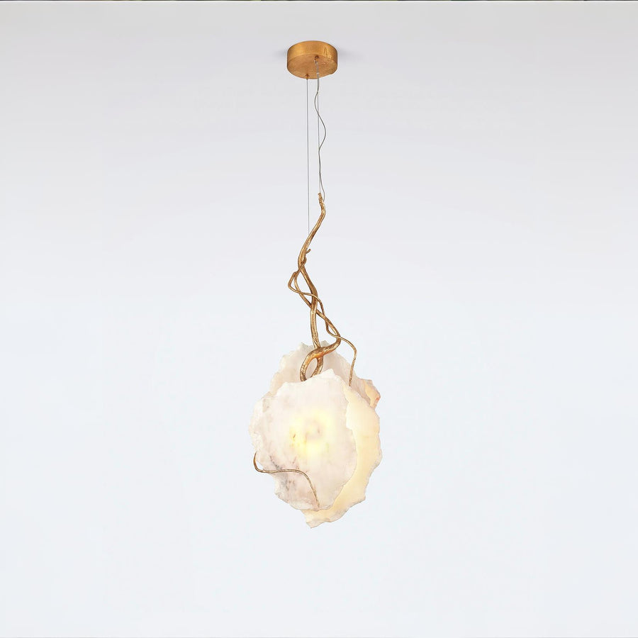 Modern pendant light with a white mabrle and gold metal fixture on a white background