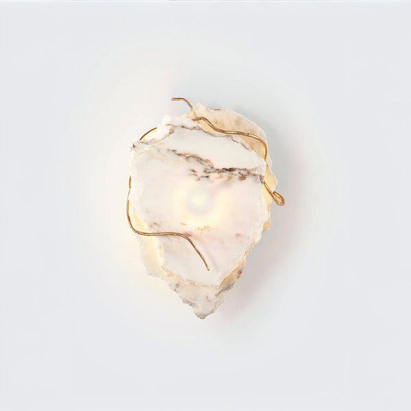 Marble wall sconce with gold accents on a white background