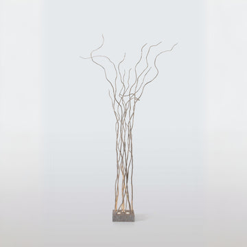 Decorative floor lamp of branches on a white background