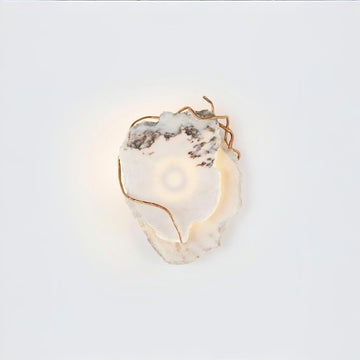 Decorative wall light with marble and gold metal finish accents on a white background