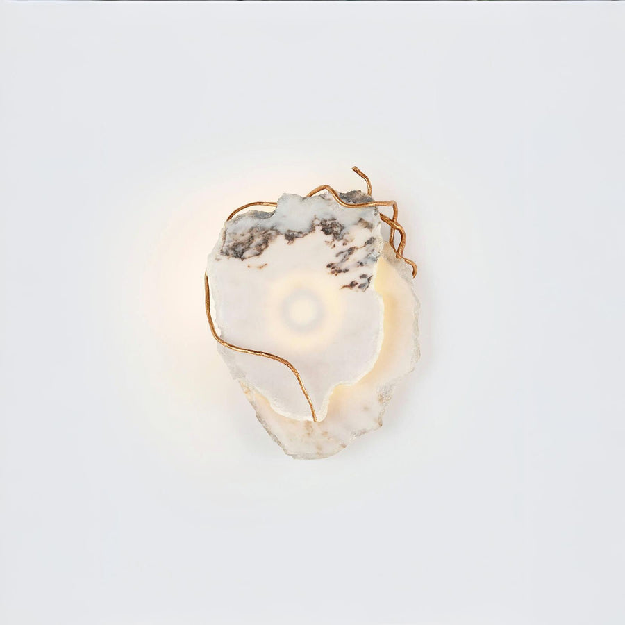 Decorative wall light with marble and gold metal finish accents on a white background
