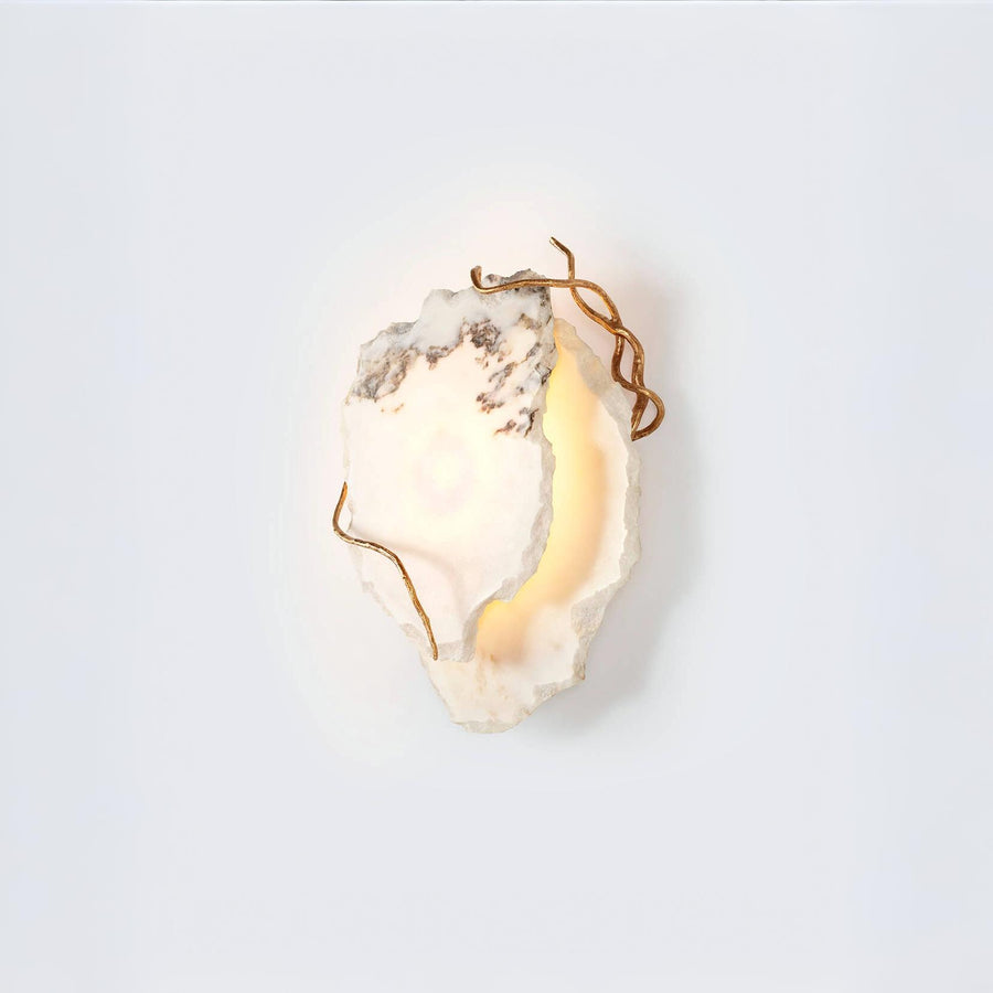 Decorative wall light fixture with a natural marble on a white background