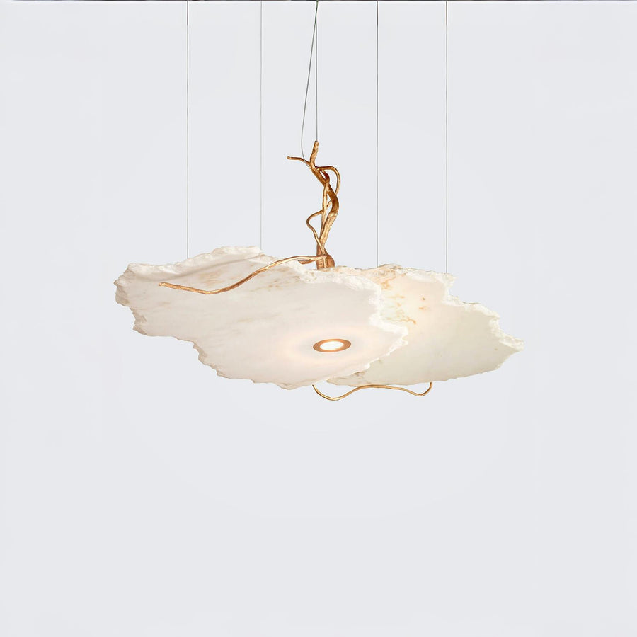 White pendant light with gold accents on a white background