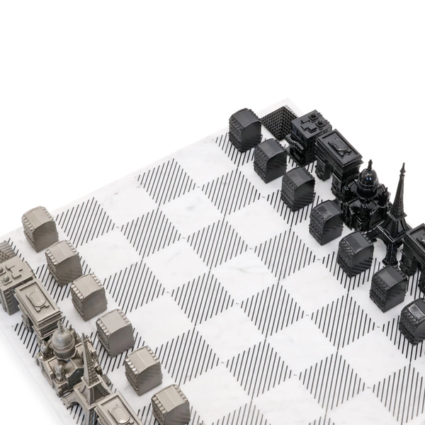 Skyline Chess Steel Paris Marble Board featuring luxury stainless steel chess pieces inspired by Paris architecture, available at Spacio India.