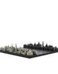 A India monument chess set, featuring detailed gray and black domed buildings on a dark base, photographed against a solid white background from Skyline, available at Spacio in India. 