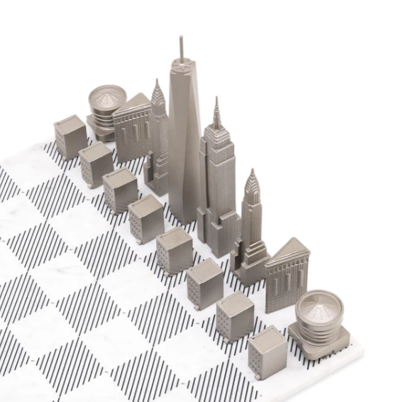 Top view of New York Skyline Chess Steel 2 City New York San Francisco on Carrara Marble Board available at Spacio India