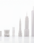 New York skyline chess pieces in Skyline Chess Acrylic 2 City London New York Folding Board, featuring Empire State Building, Chrysler Building, and One World Trade Center, available at Spacio India.