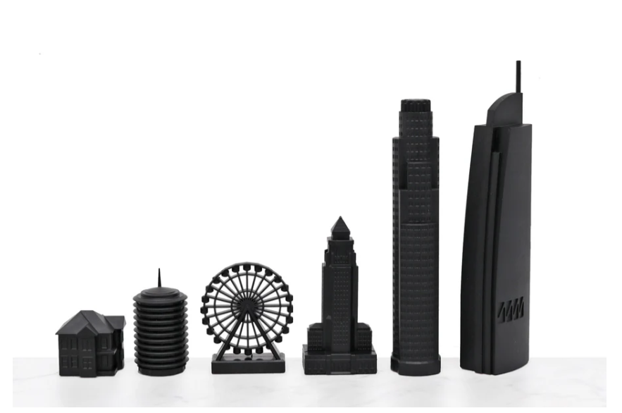 Premium chess pieces from the Skyline Chess Acrylic Los Angeles Map Board Set, inspired by iconic LA buildings, available at Spacio India.