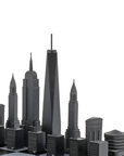New York skyline chess pieces in Skyline Chess Steel 2 City London New York Hatch Board, featuring Empire State Building, Chrysler Building, and One World Trade Center, available at Spacio India.