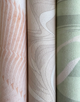 A row of Affreschi Studio Milo Tailor Collection SM01 handcrafted textured wallpapers in green, pink, and white by Affreschi.