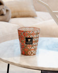 A Baobab Bohom Gyula Candle MAX16BGY fills the home with a floral fragrance as it sits on a table in a living room.