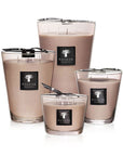 A Baobab Candle Max 16 Serengeti MAX16ASP scented candle in a glass container with a black lid.