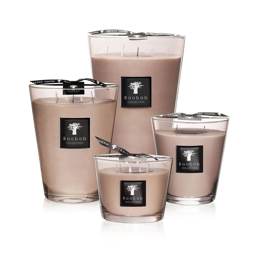 A Baobab Candle Max 16 Serengeti MAX16ASP scented candle in a glass container with a black lid.