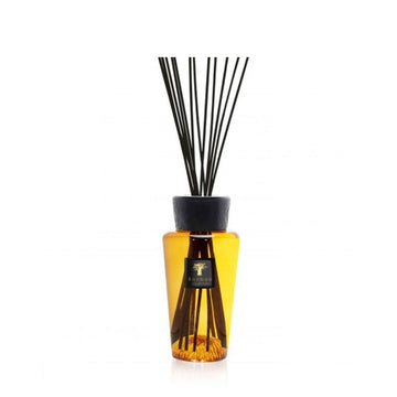 A Baobab Curi De Russie Diffuser 500ml DIF500CUR, exuding a captivating home fragrance, featuring sleek black sticks for an elegant touch.