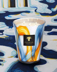 A Baobab Nirvana Holy Candle Max 16 MAX16NHO with a blue and yellow design on it, offering long burning hours.