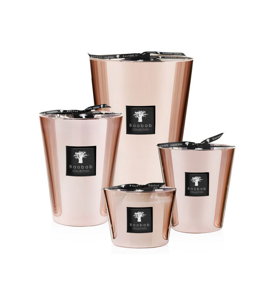 A set of four Baobab Roseum Candle MAX16ROS adorned with black ribbons, perfect for adding a touch of femininity to any space.