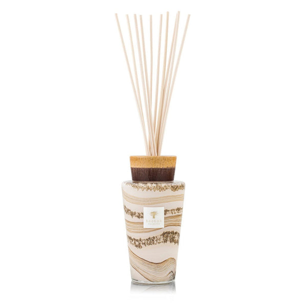 A decorative Baobab diffuser with wooden sticks and a white background.