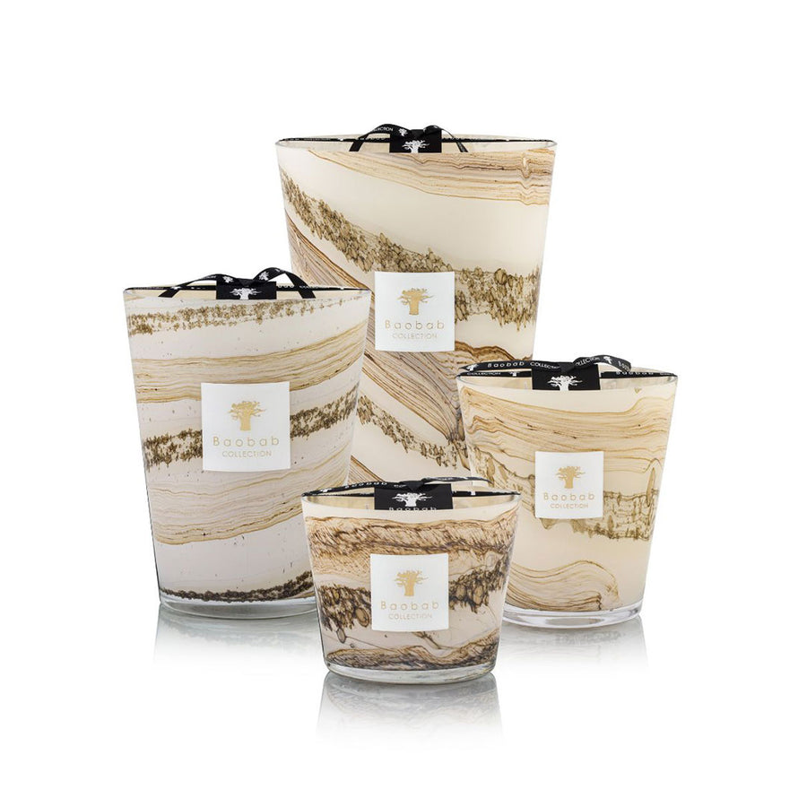 A set of Baobab Sand Siloli Candles with a marble pattern on them.