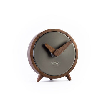 A minimalist Nomon Atomo Table T AMTN wooden clock on a white background.