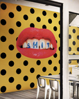 A luxury dining room with Londonart Toilet Paper Wash Your Mouth yellow and black polka dot wallpaper.