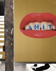A luxurious room adorned with a stylish wallpaper featuring a provocative poster of a mouth with the word "shit" written on it, made by Londonart Toilet Paper Wash Your Mouth.