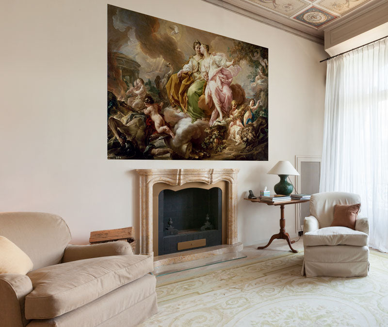 An ornate living room with an Affreschi Classic Art AC 100604 painting of landscapes hanging on the wall against a backdrop of skies.