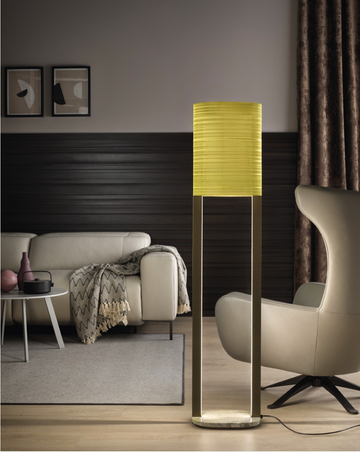 A luxurious Masiero Ebe Floor Lamp adds artistic expression to a living room with decorative lights.