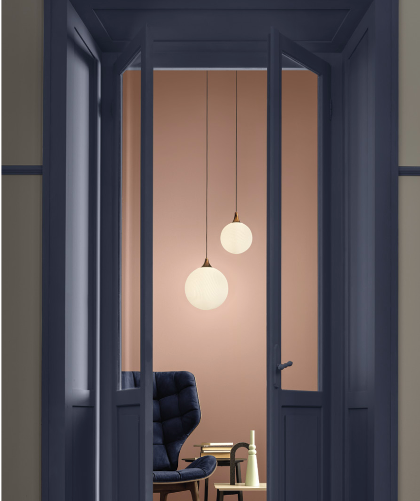 A doorway adorned with a Masiero Tee Pendant Lamp, creating a captivating and luxurious ambiance.