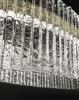 A Masiero Vegas Table Lamp chandelier made of ice with a black background.