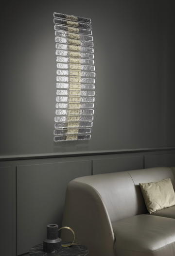 A Masiero Vegas Wall Sconce from the Masiero Collection, adding opulence to a living room through decorative lighting.