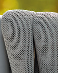 A close up of a Sifas Basket Sofa Collection chair with waterproof properties.