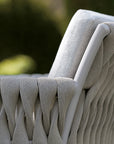 A close up of an outdoor chair with a cushion from the Sifas Basket Sofa Collection by Sifas.