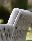 A close up of an outdoor chair with a cushion from the Sifas Basket Sofa Collection by Sifas.