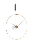 An elegant Nomon wall clock with a circular shape, perfect for a modern living area.