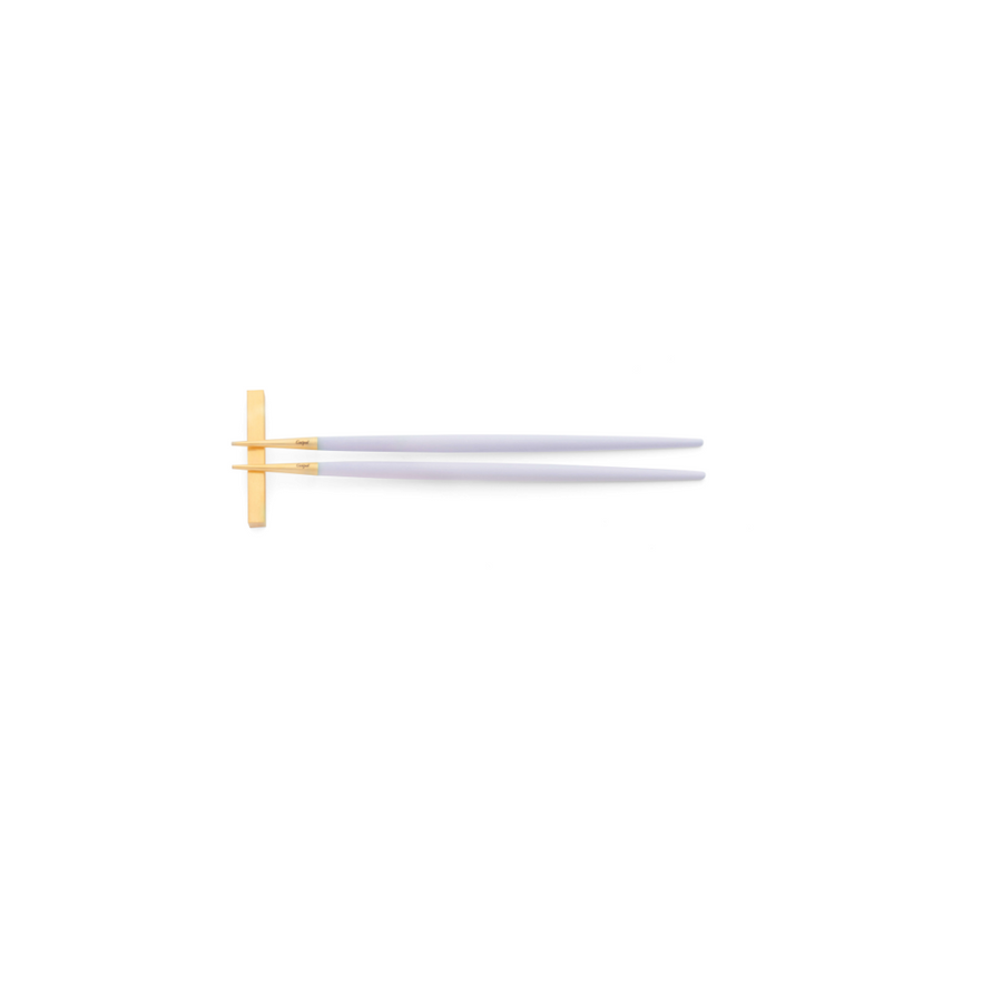 Cutipol Goa violet matt gold finish, black resin handles, and minimalist design for a luxurious dining experience - on a white background chopsticks on chopstick rest