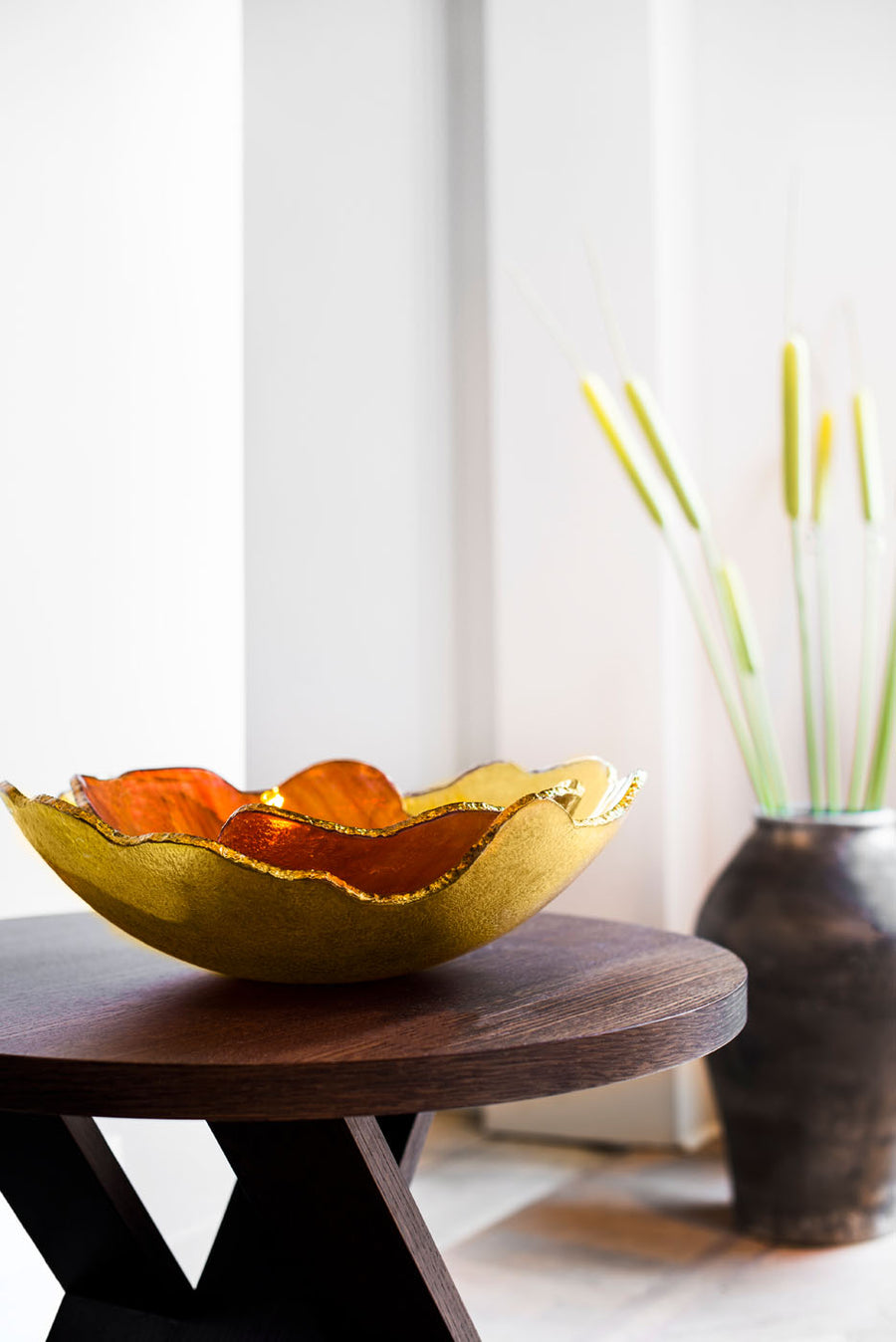 A pair of Gardeco Mapa bowls on a wooden side table styled by Navin Kanodia of Spacio Mumbai in a luxury living room