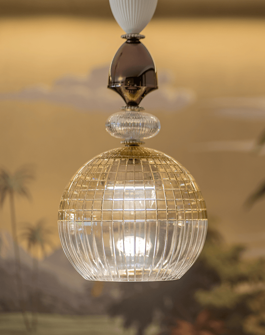 A very close up of Amelie pendant light by Italamp featuring crystal and white/nickel metal, blending classic elegance with modern design. Perfect for luxury interiors.