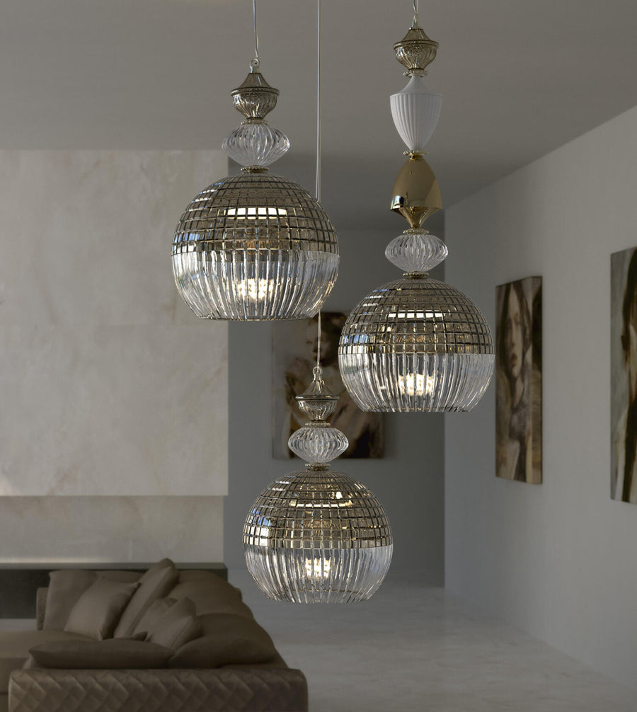 A cluster of Amelie pendant light by Italamp featuring crystal and white/nickel metal, blending classic elegance with modern design. Perfect for luxury interiors. Styled in a luxury living room of a Mumbai high rise apartment