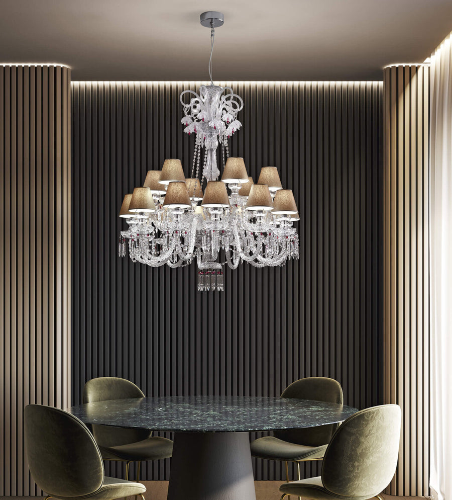 Chanel Collection chandelier by Italamp with carved crystal, chrome-finished metal, and dove fabric diffusers, showcasing Italian luxury and timeless design. The chanel chandelier above a marble top dining table in a luxury modern interior