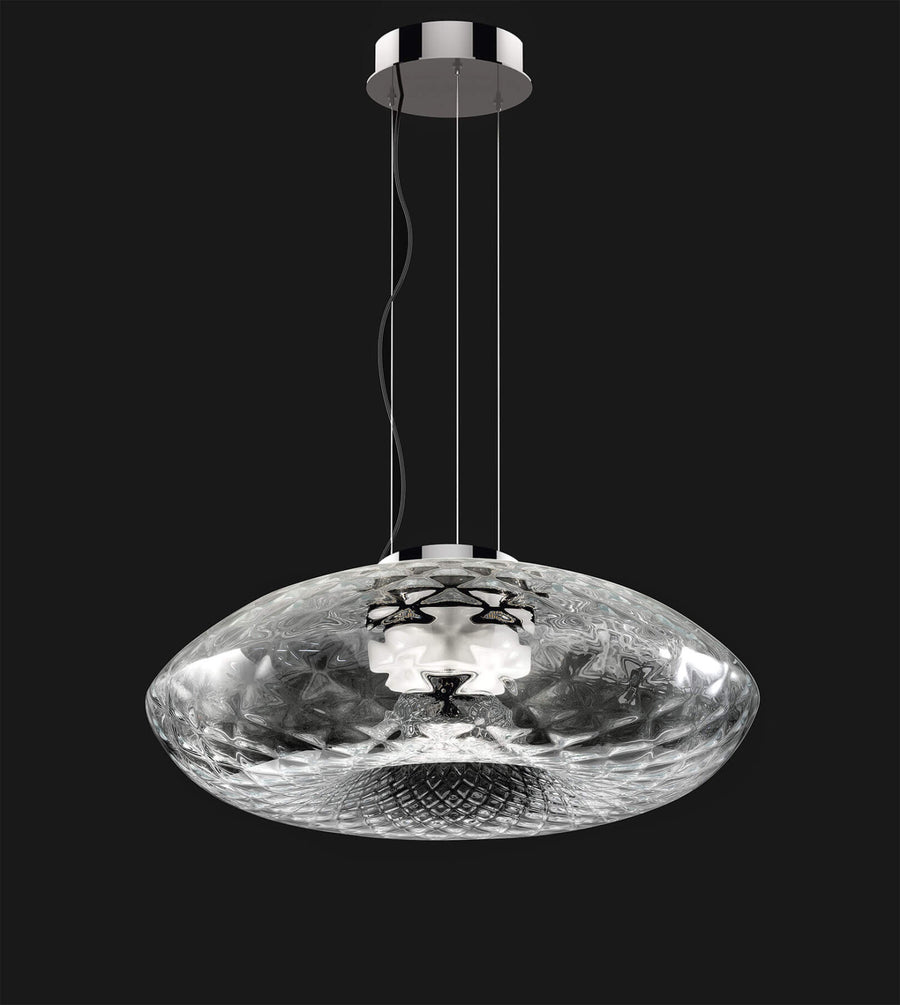 A pendant light showing details of the design on a white background. Cicla collection by Italamp, featuring handmade Balloton glass lamps in transparent, white, and smoked finishes with grooved Vicenza stone bases and metal accents.