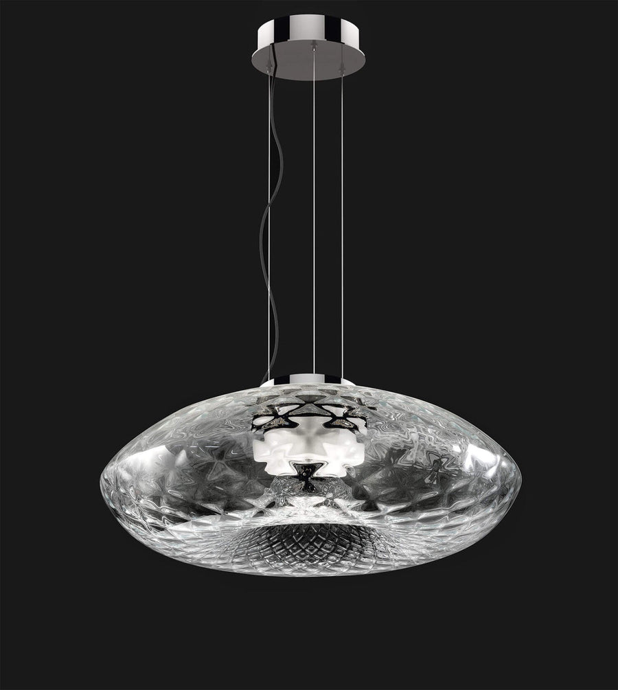 A pendant light showing details of the design on a white background. Cicla collection by Italamp, featuring handmade Balloton glass lamps in transparent, white, and smoked finishes with grooved Vicenza stone bases and metal accents.