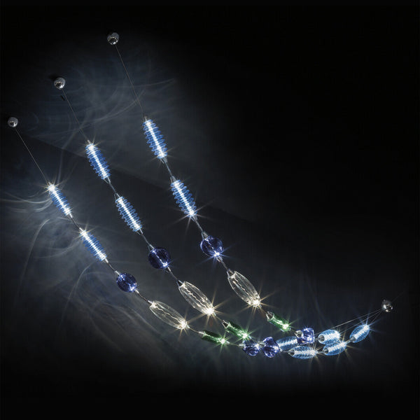 Colier collection by Italamp, featuring modular blown glass elements in vibrant colours and shapes, designed by Marc Sadler to create magical lighting effects. 3 pc installation in gradient blue colour, green and clear colour on a dark colour ceiling. 