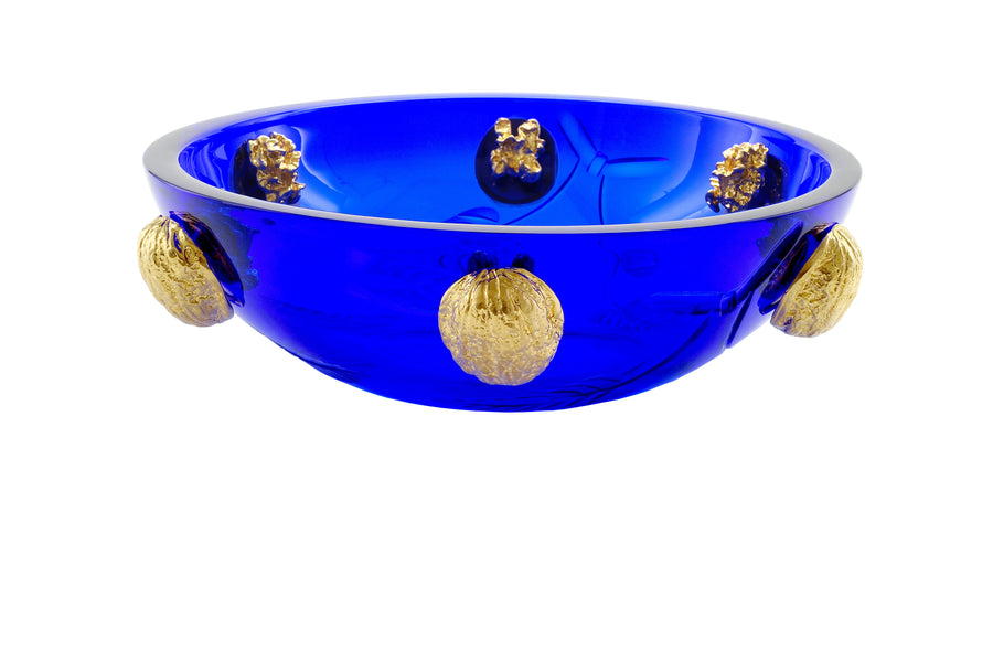 A stunning Mario Cioni Purpose Blue Gold Walnut Crystal Bowl with deep blue crystal, gold walnut accents, and intricate engraved leaf patterns, handcrafted in Italy. A closeup view