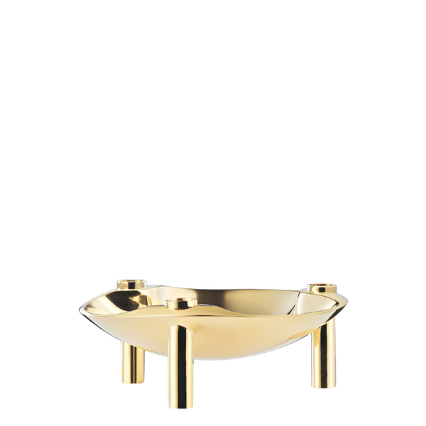 A polished gold metal bowl cum candle holder with three cylindrical legs, shown on a plain white background.