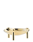 A polished gold metal bowl cum candle holder with three cylindrical legs, shown on a plain white background.