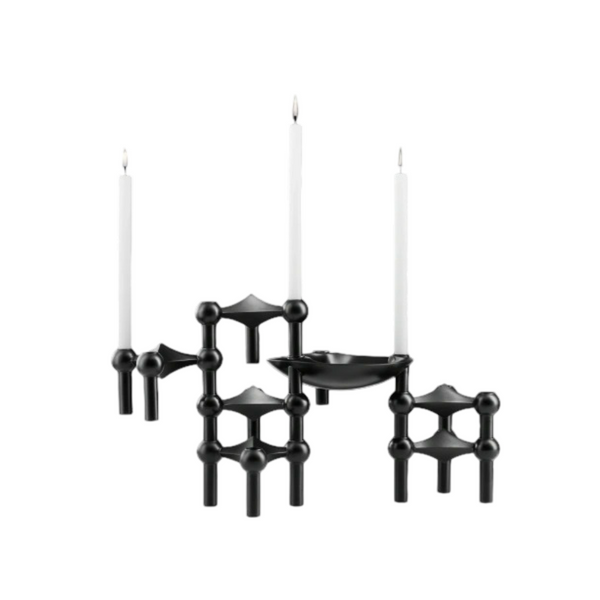 A modern black metal candle holder set with three white taper candles, featuring a central bowl-shaped holder and three geometric armrests with spherical accents, shown against a plain white background.