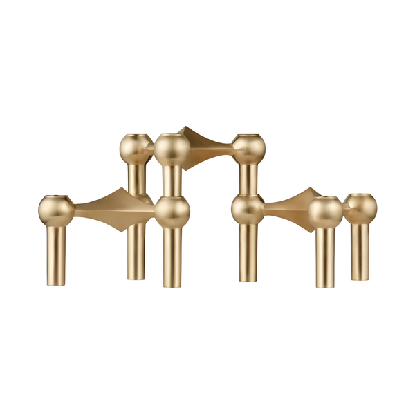 A set of modern candle stand brass fixtures with spherical and geometric decorative elements, shown against a plain white background.