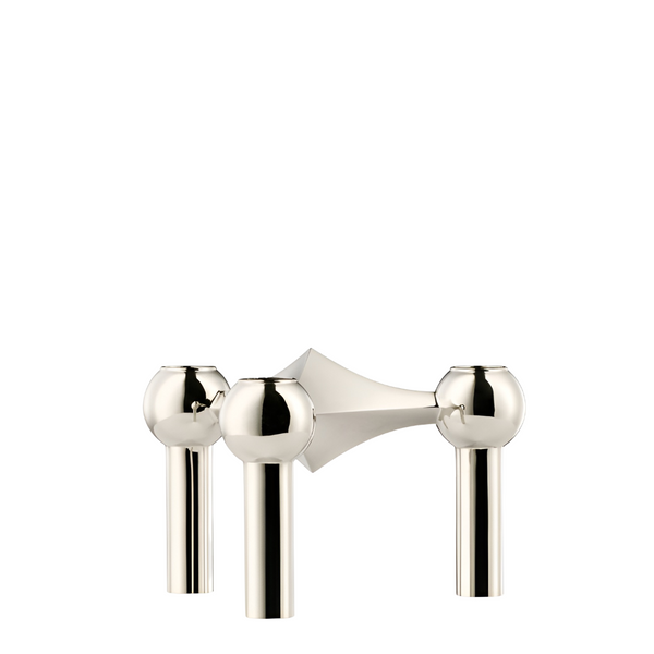A chrome candle stand with three spherical knobs and cylindrical stems, shown on a plain white background from Stoff Nagel available at Spacio in India. 
