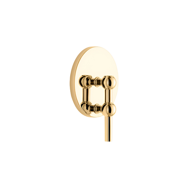 A polished gold wall-mounted candle holder with a circular backplate and spherical decorative joints, shown against a solid white background.
