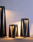 Set of modern indoor outdoor floor solar lanterns against a light wall  by Les Jardins from Spacio retail stores in India. 